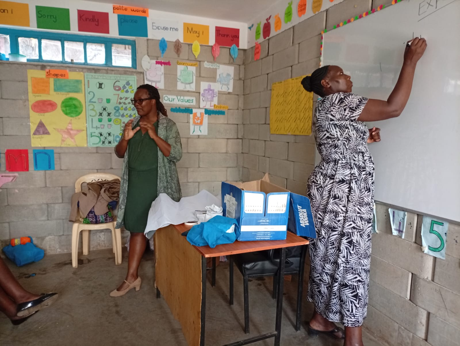 MamaPlus trainers conducting caregiver education session